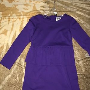 a purple fitted miley mini dress